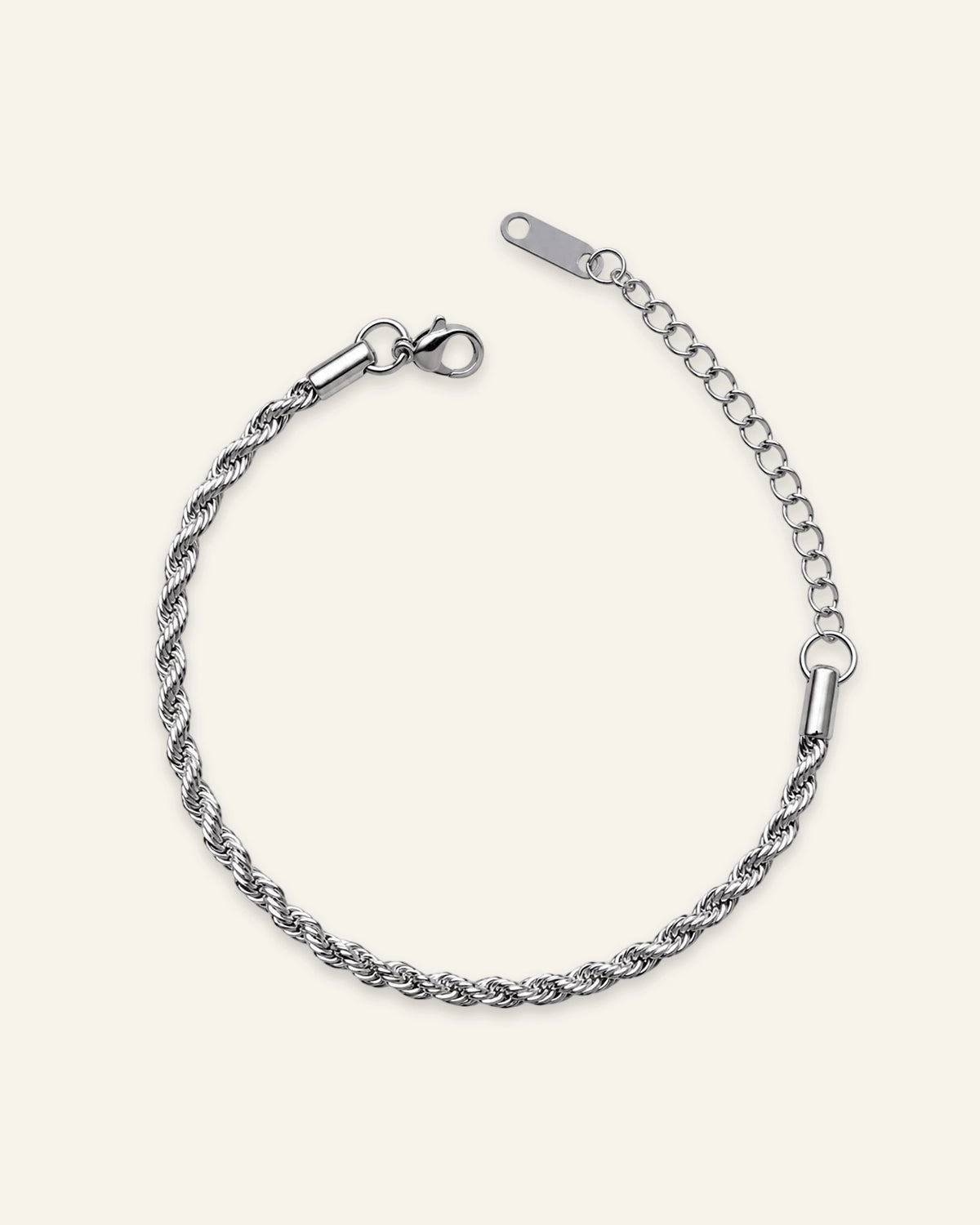 A silver-toned twisted rope chain bracelet with a lobster clasp and extension chain, displayed on a light cream background.