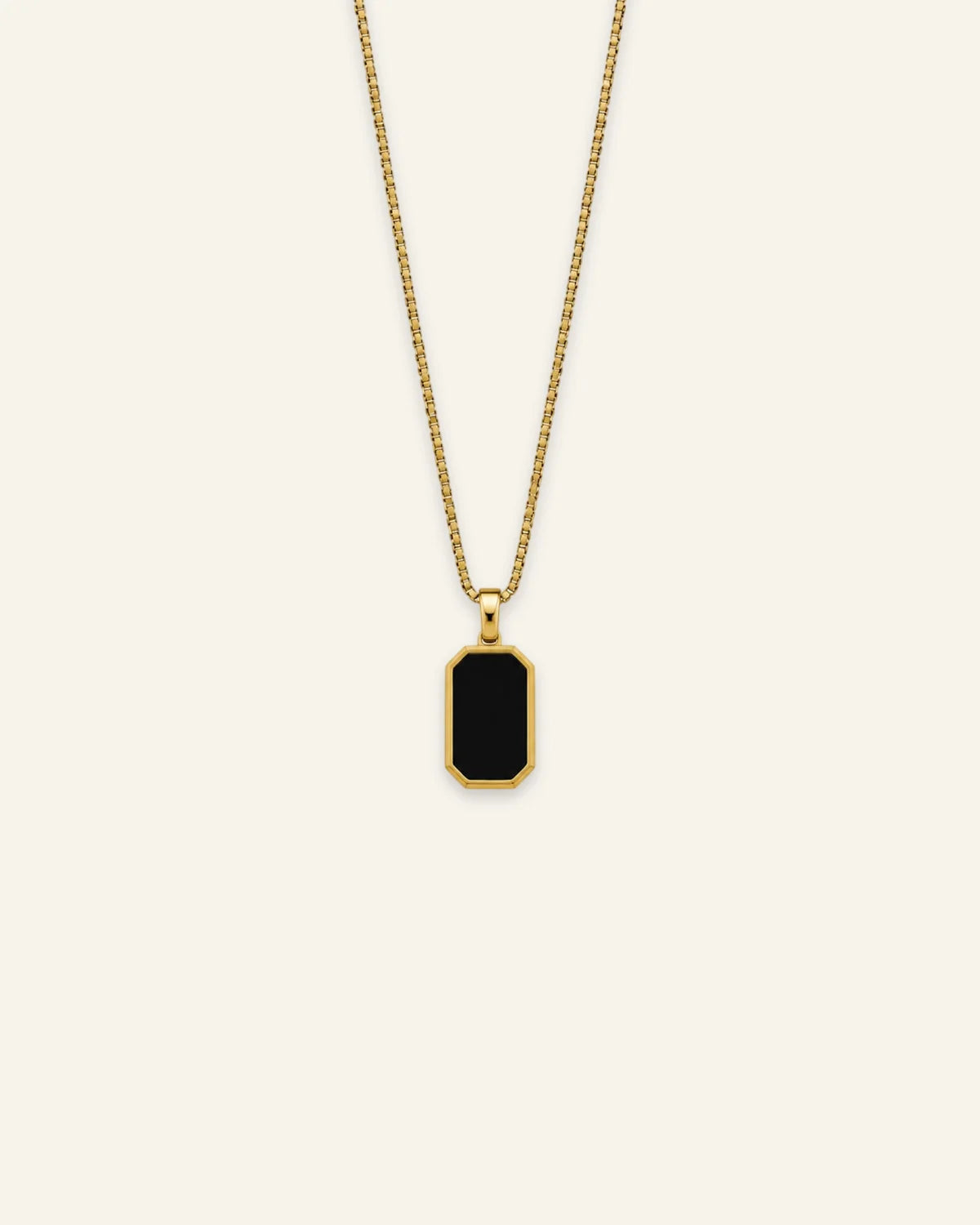Gold octagonal black enamel pendant necklace featuring a fine box chain
