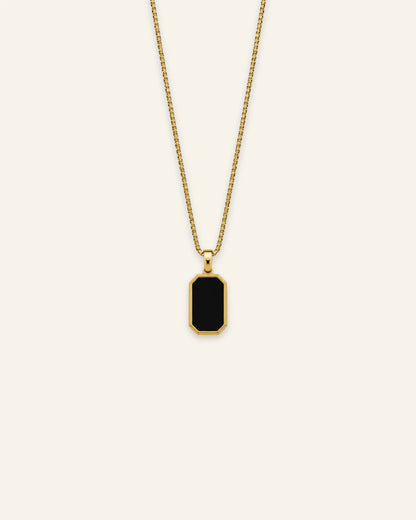 Gold octagonal black enamel pendant necklace featuring a fine box chain