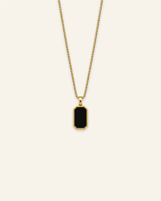 Gold octagonal black enamel pendant necklace featuring a fine box chain