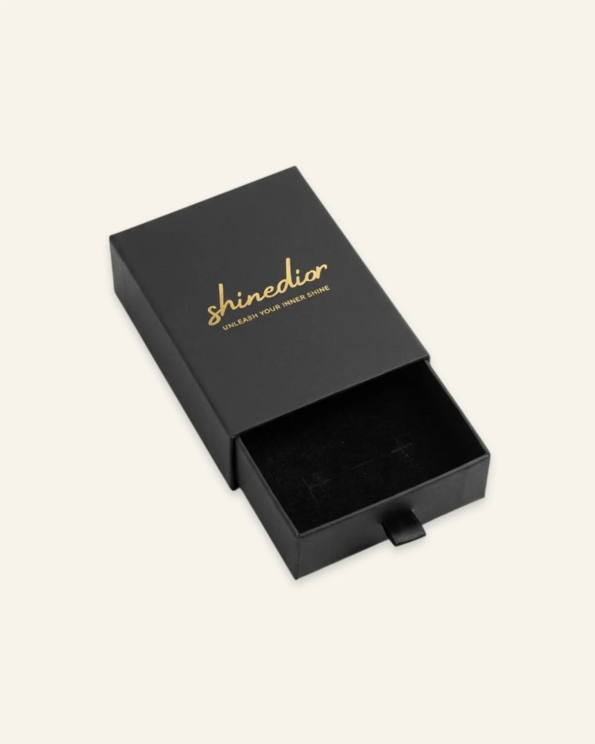 Shinedior matte black pull-out jewelry box with gold logo and black velvet insert on clean white backdrop.